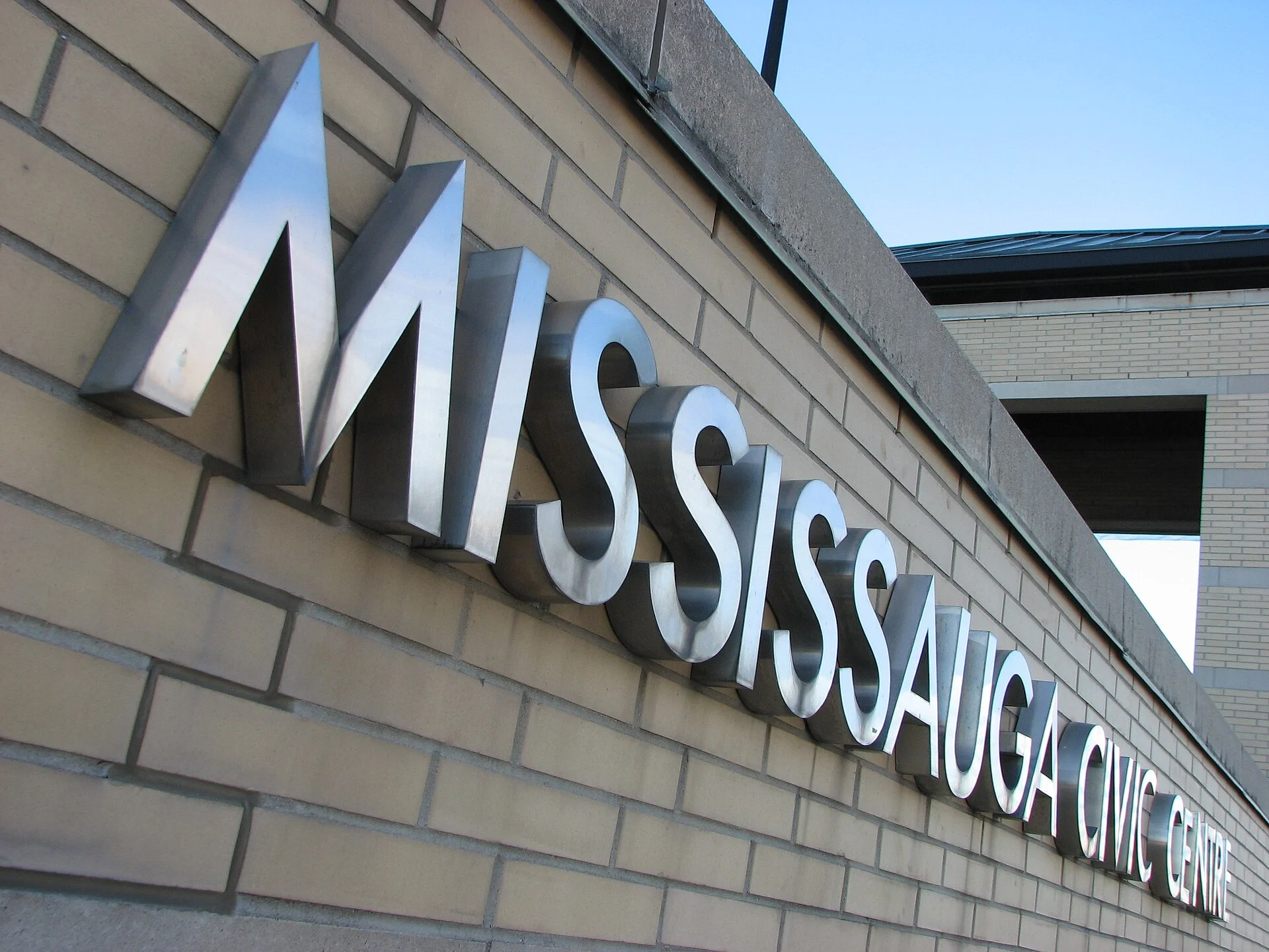 Metal lettering spelling Mississauga Civic Centre on the city hall wall