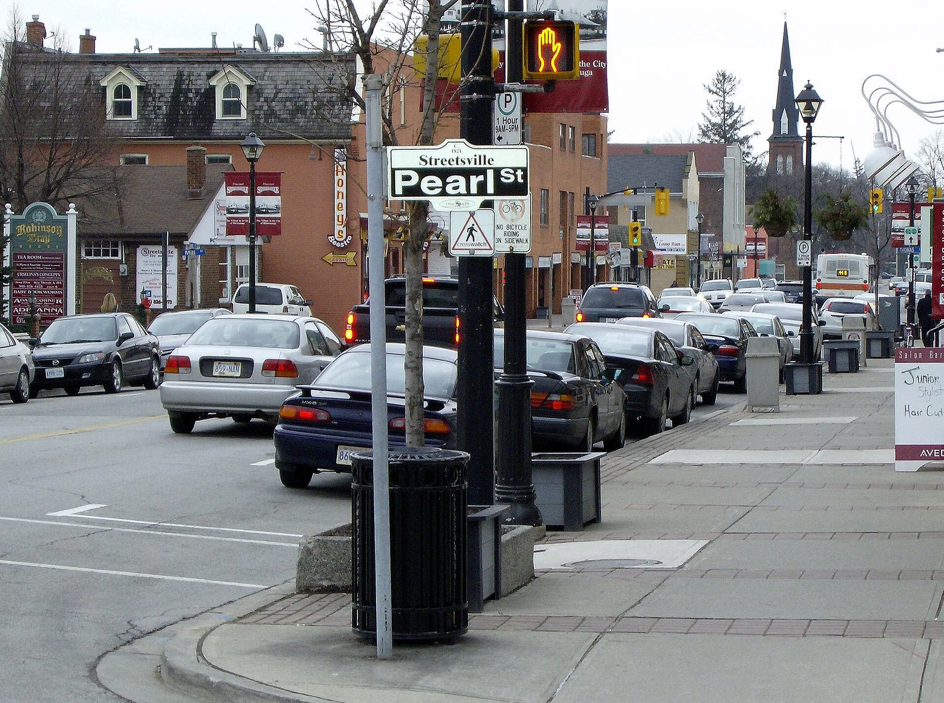 Shops and parked cars along Queen Street in Streetsville