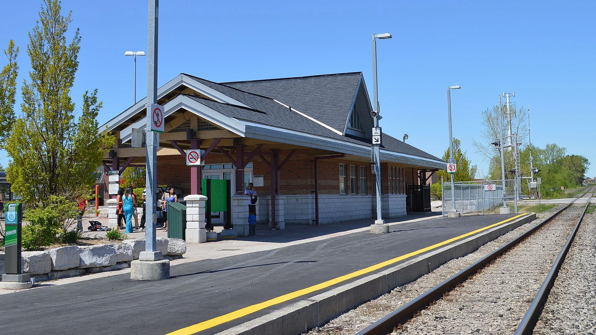 The single-track platform and peaked-roof station building at Mount Joy GO in Markham