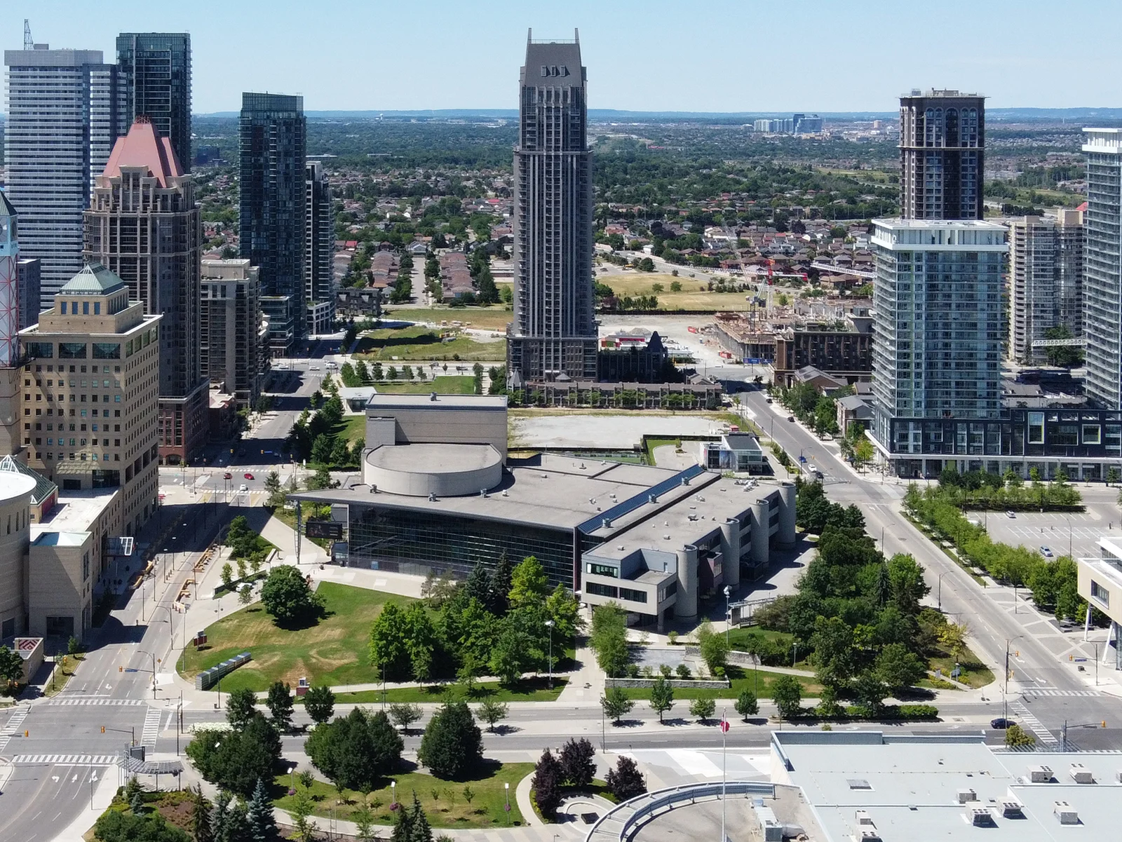 Aerial view of the Living Arts Centre in downtown Mississauga, surrounded by condo towers on a summer day