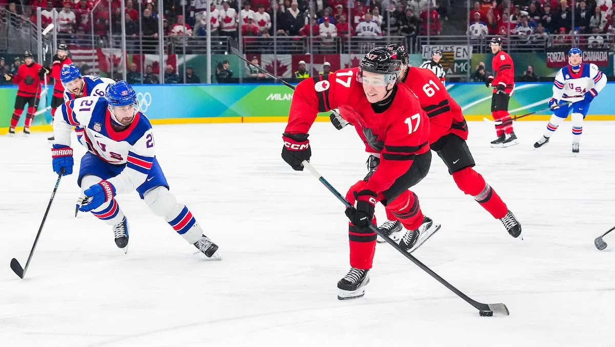 Canada's Macklin Celebrini shoots the puck against the United States in the men's Olympic hockey gold medal game in Milan