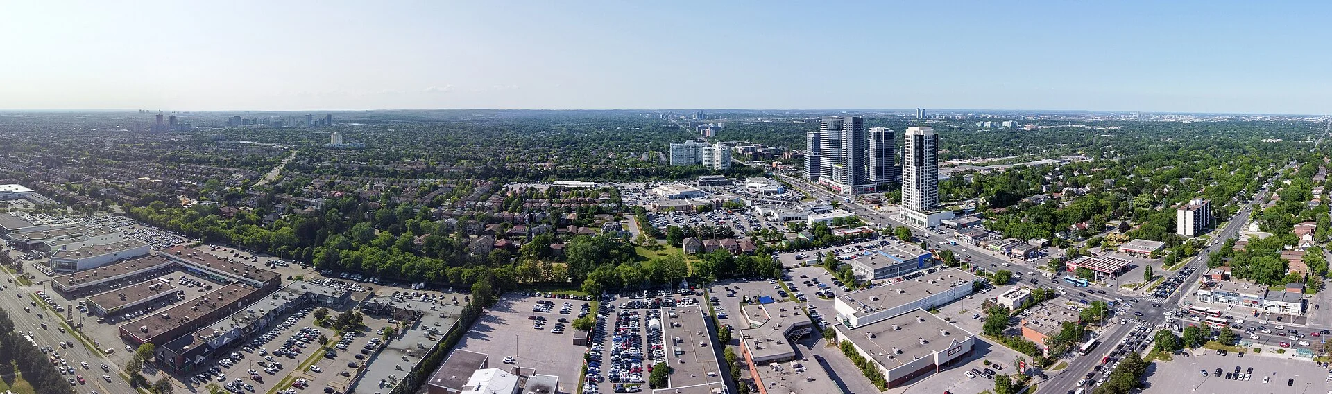 Aerial view of Thornhill looking east-northeast from near Yonge Street and Steeles Avenue, with plazas, homes and a cluster of towers