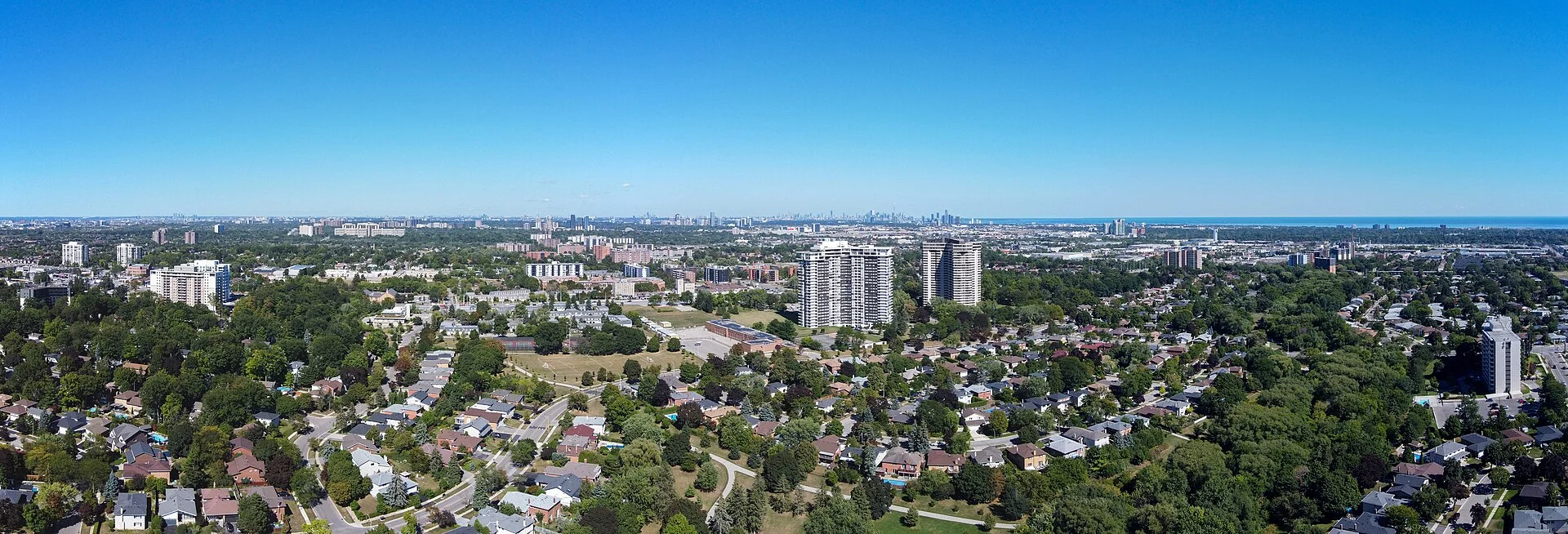 Aerial view of the Applewood area of Mississauga, with apartment towers rising above tree-lined residential streets