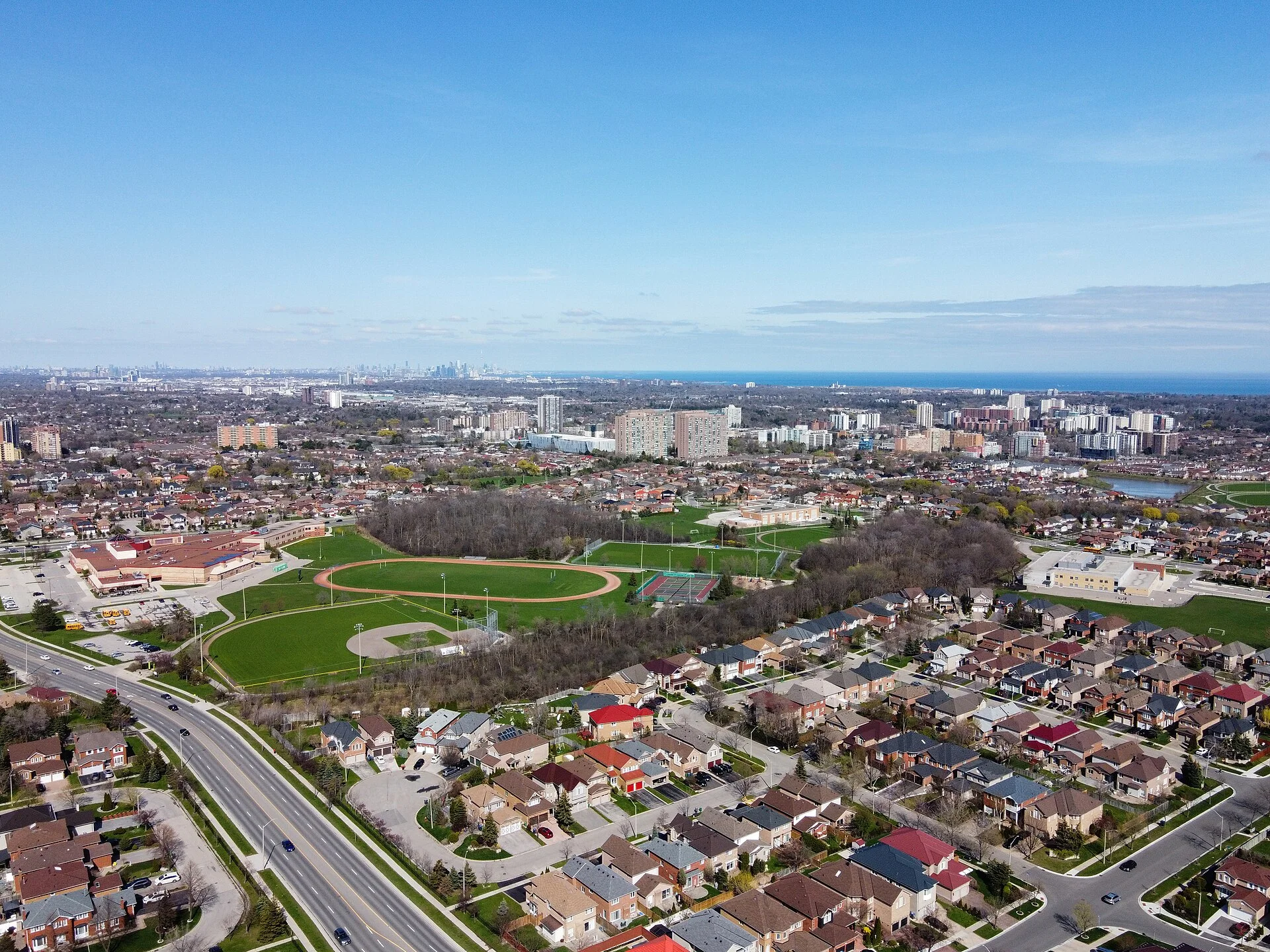 Aerial view of Cooksville in Mississauga, with detached homes in the foreground and apartment buildings in the distance