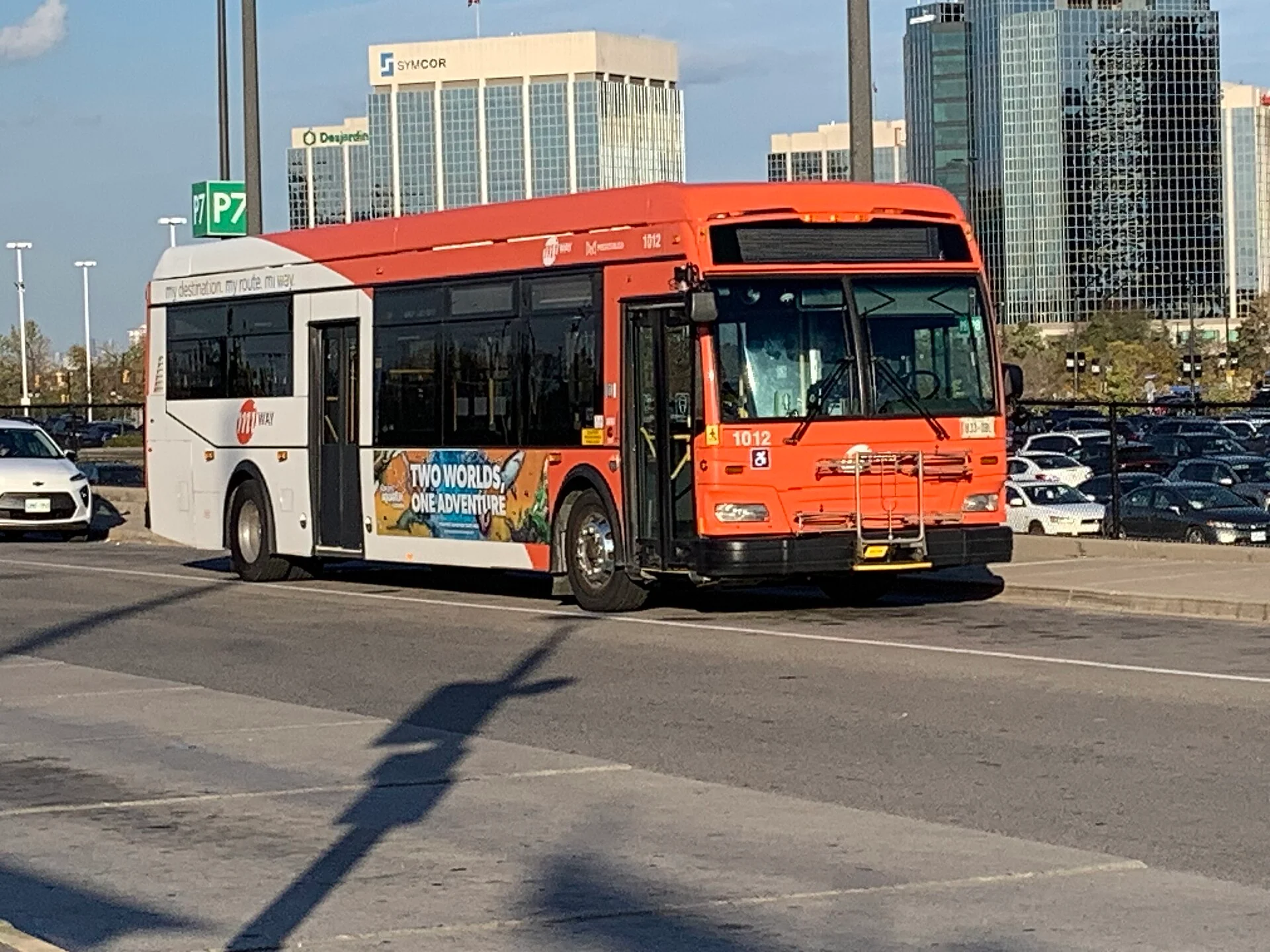 An orange and white MiWay bus at the City Centre Transit Terminal in downtown Mississauga