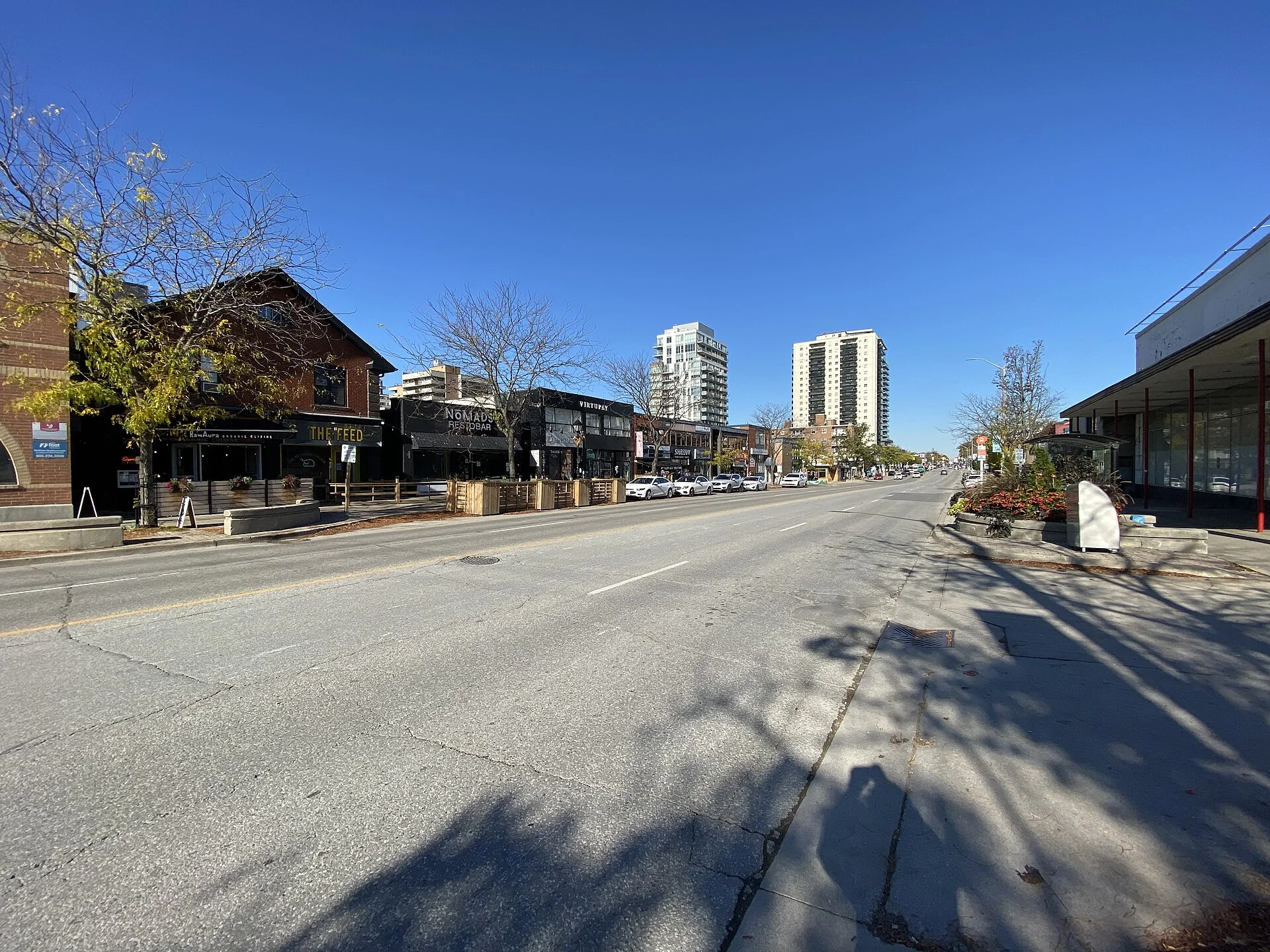 Restaurants and shops along Lakeshore Road East in Port Credit on a sunny day