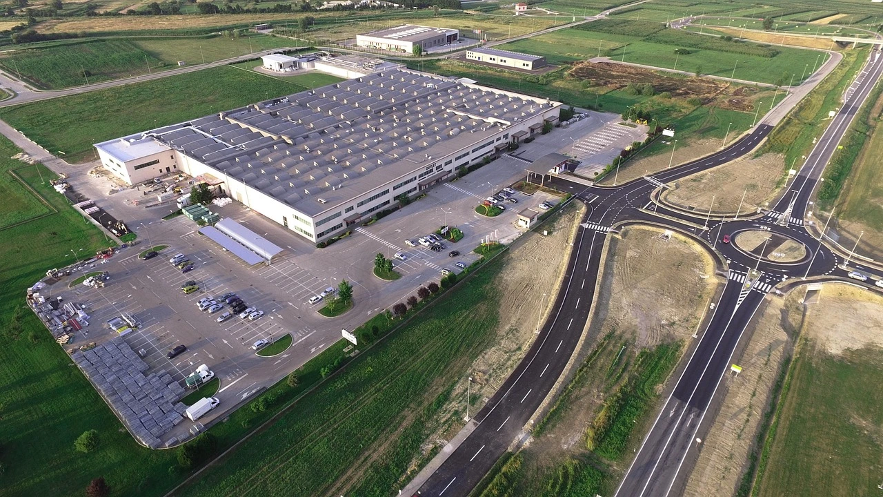 An industrial park in Simcoe County with modern manufacturing buildings under a clear spring sky.