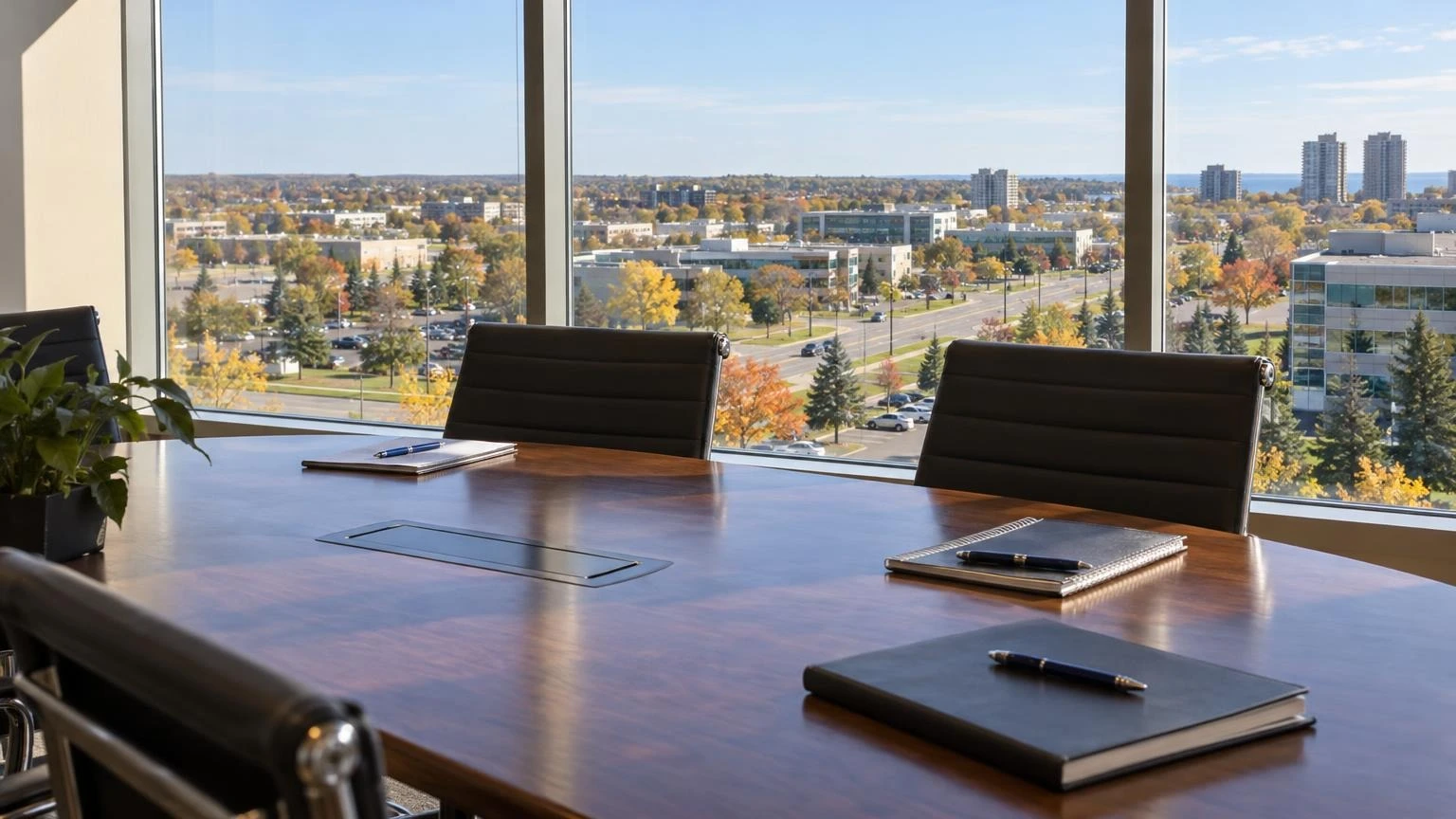 A professional office setting in Ontario with a view of a suburban business park through the window.