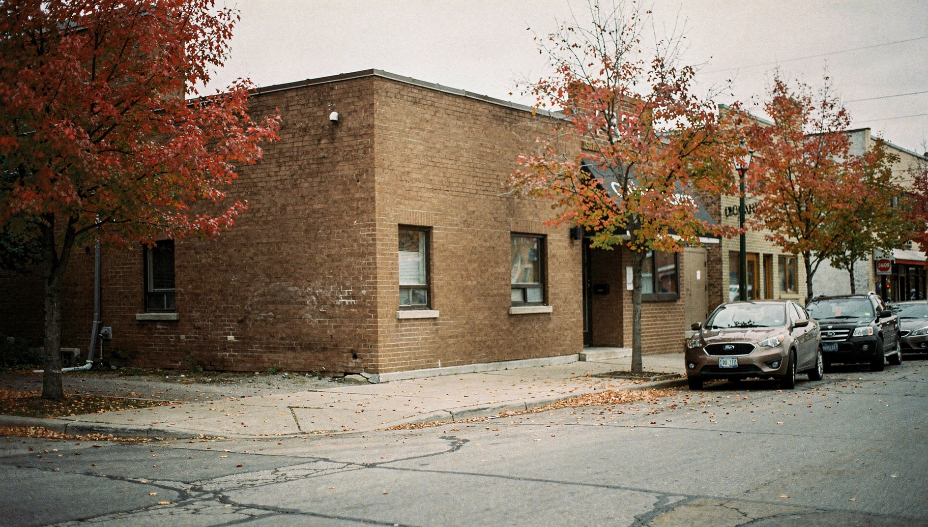 A small-town municipal building on an autumn street in Ontario.