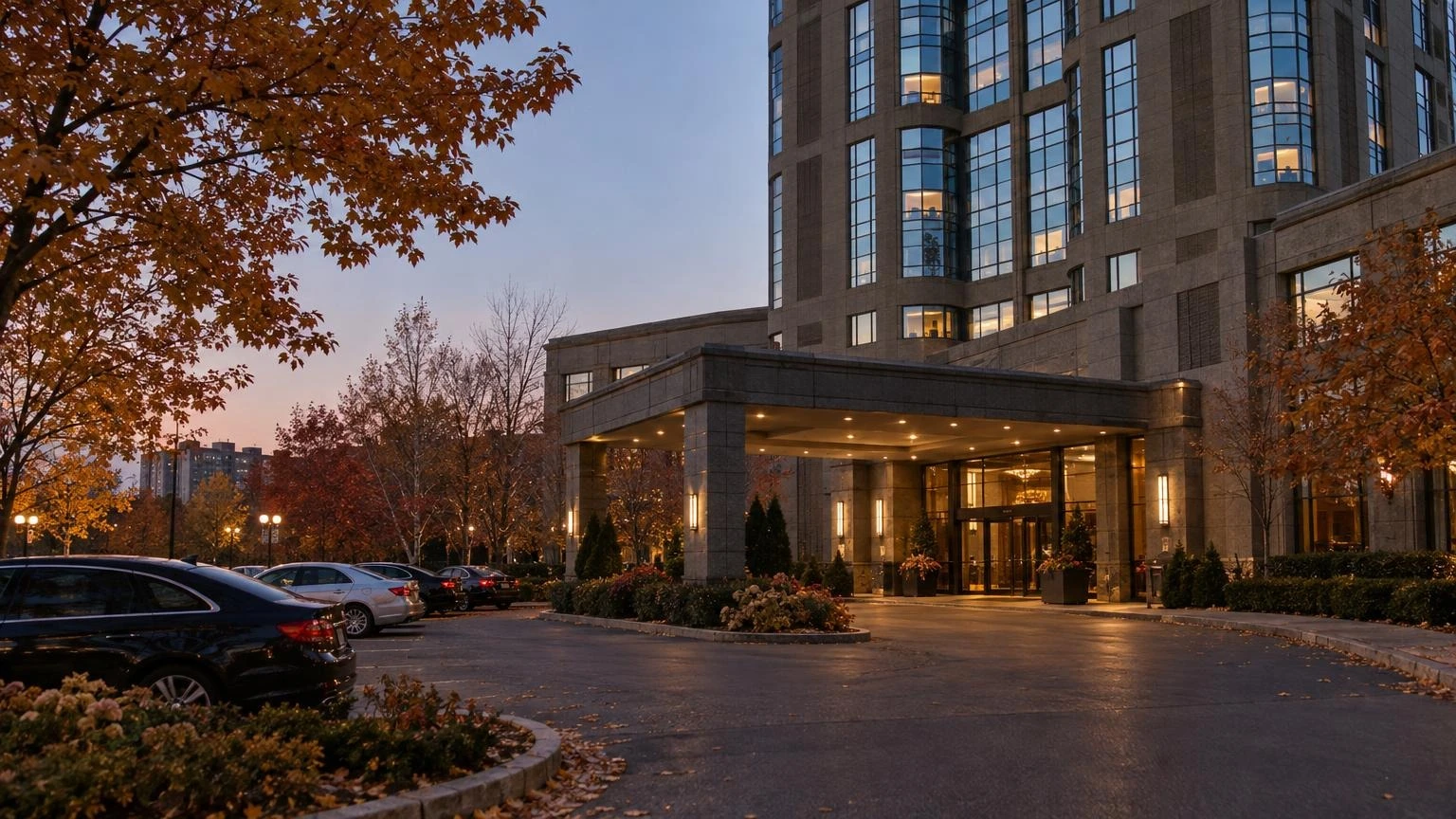 An exterior view of the Brookstreet Hotel in Ottawa during a crisp autumn evening.