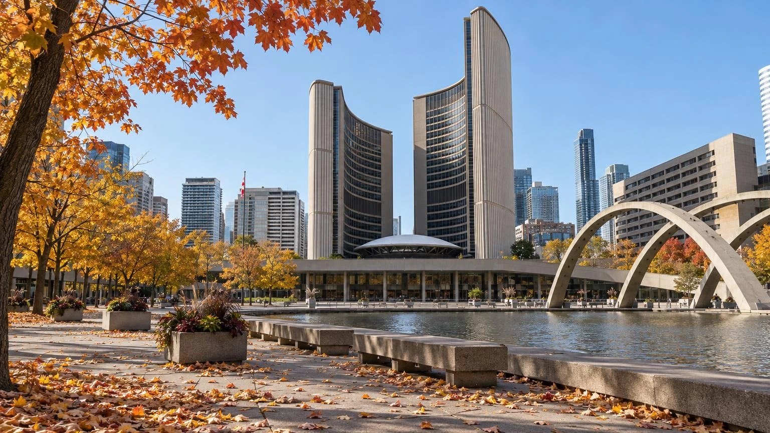 A view of Toronto City Hall and Nathan Phillips Square under an autumn sky.