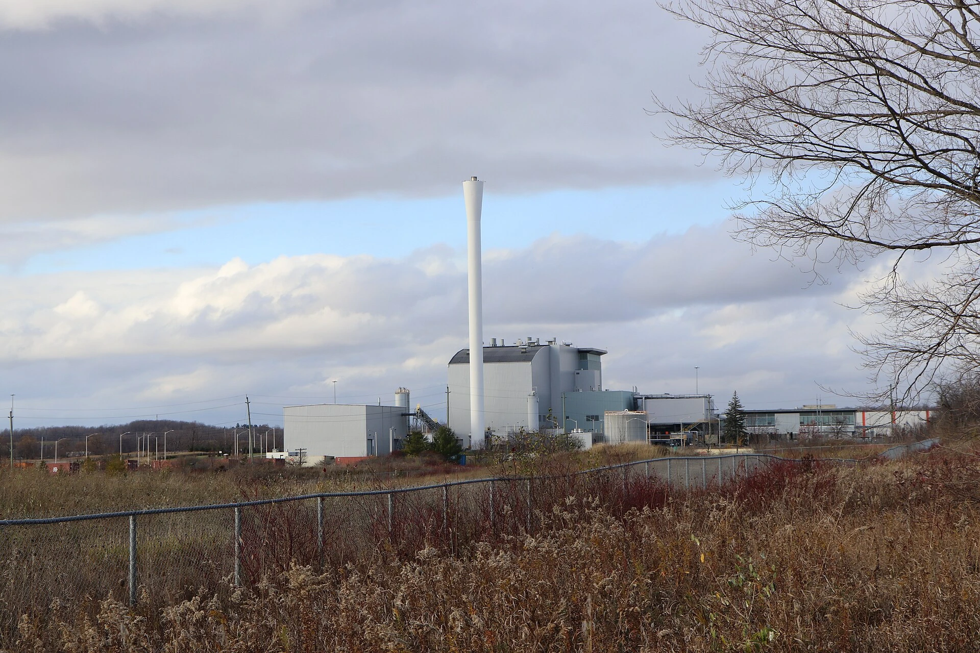 Illustration of a modern waste-processing facility exterior.