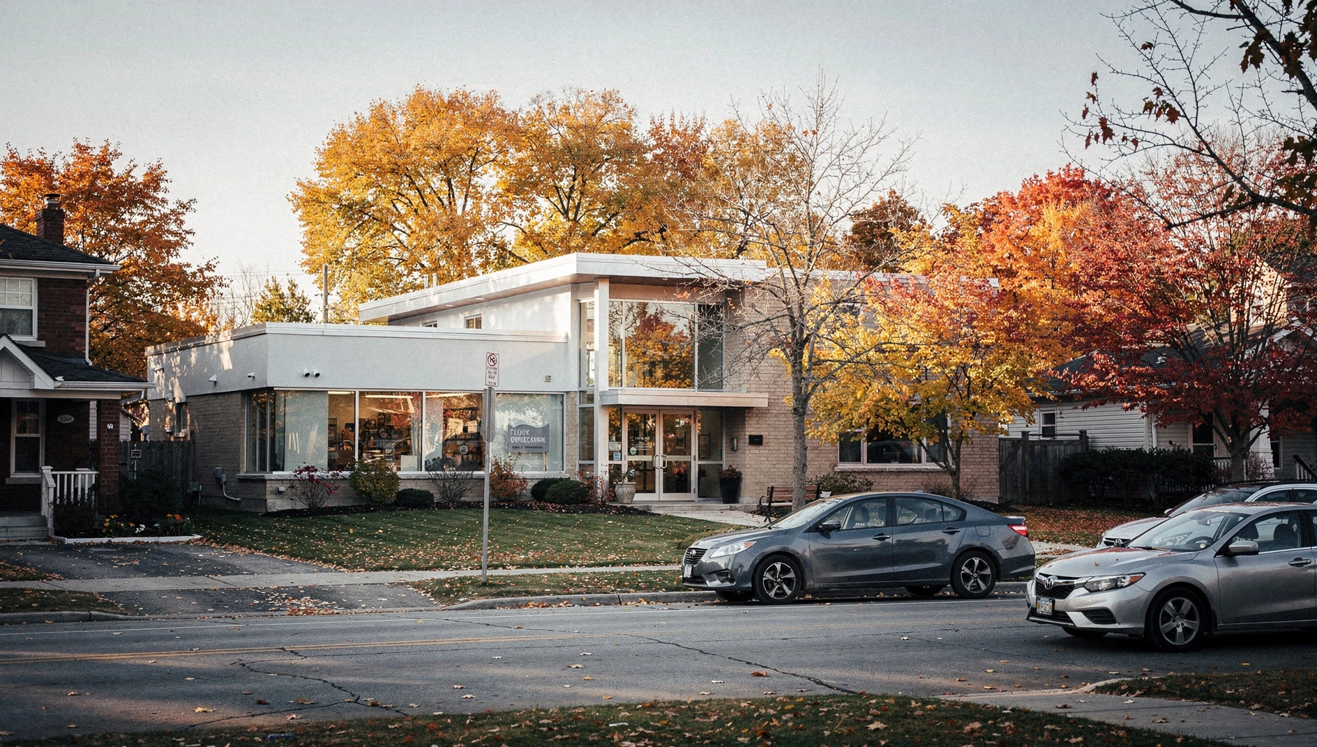 A public library building in a suburban Canadian town during the autumn season.
