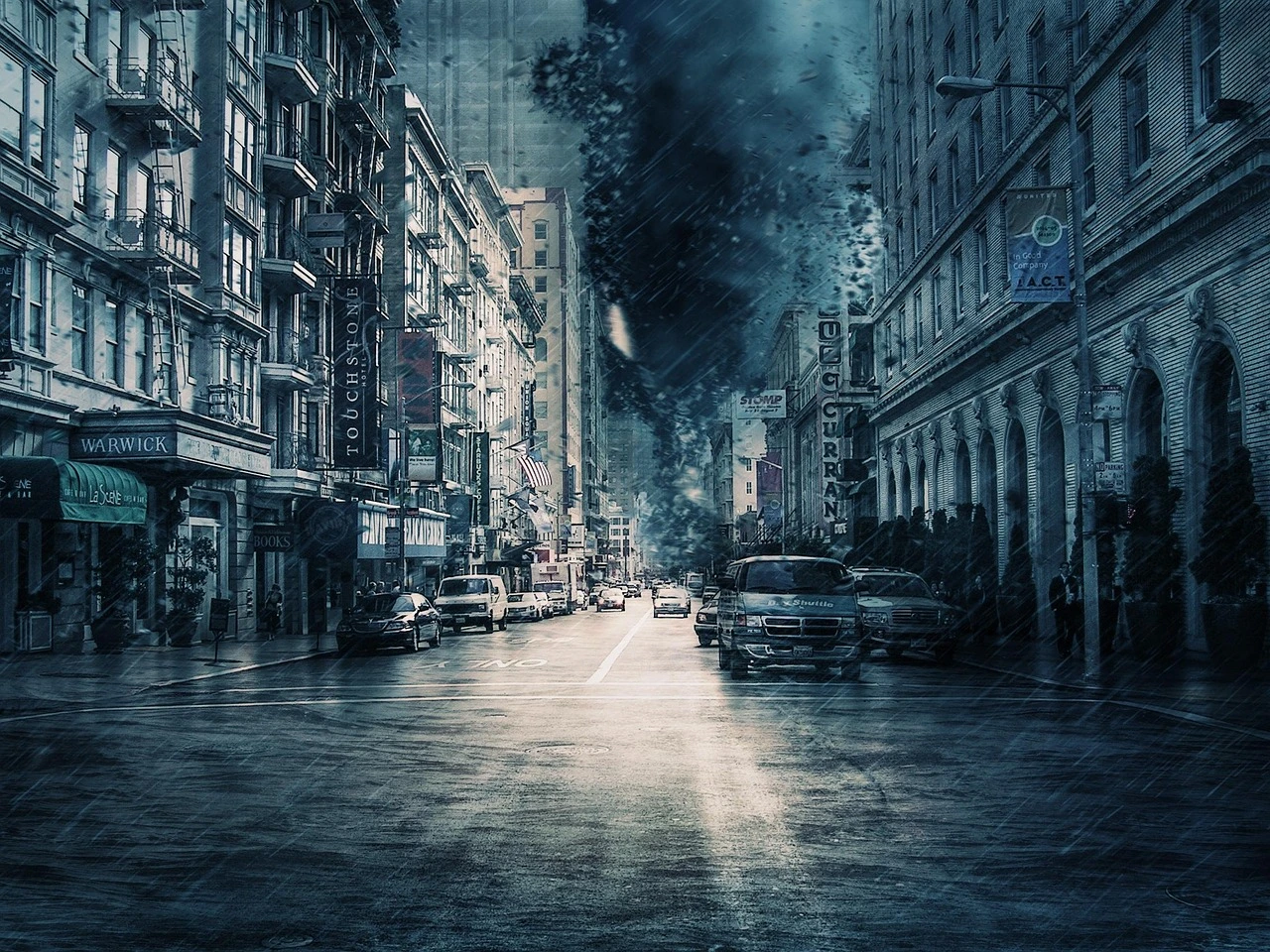 Dark storm clouds and rain over a quiet suburban street