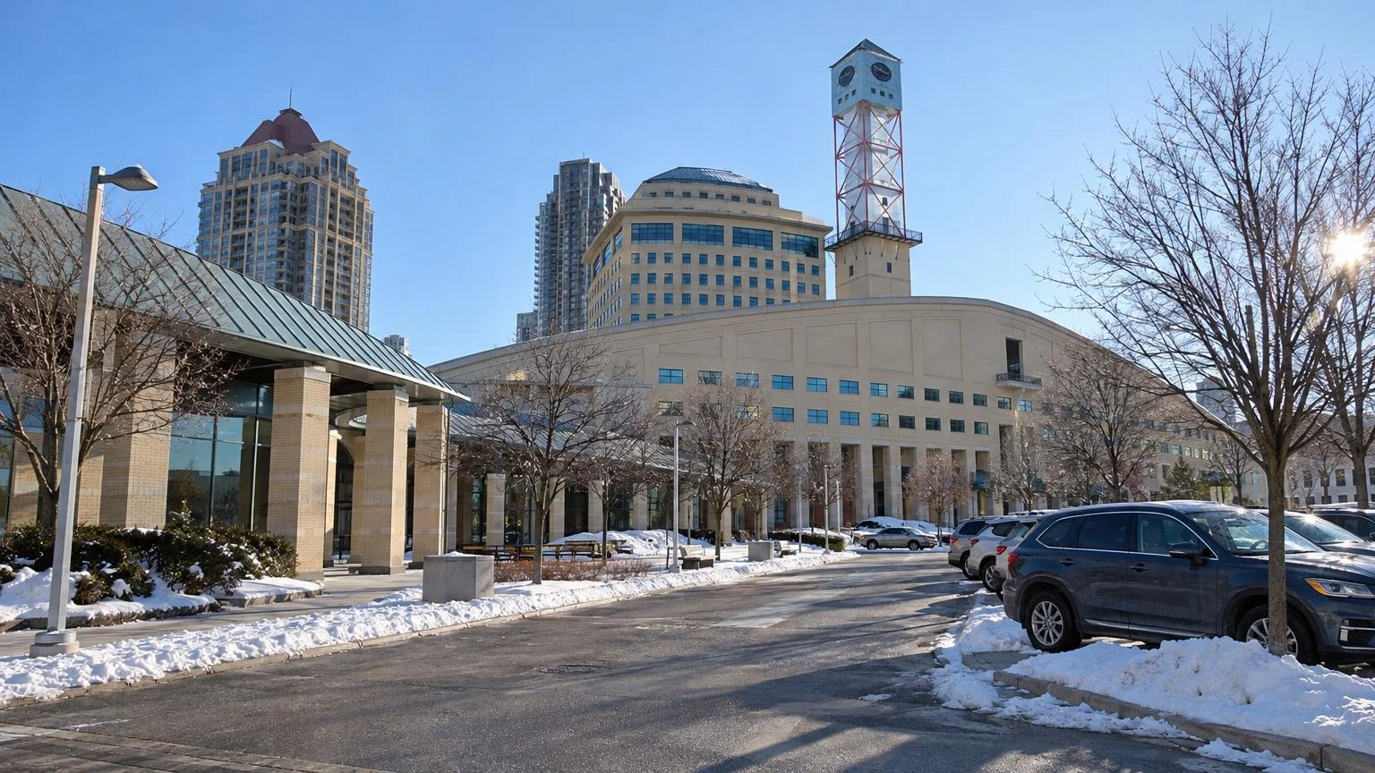 An exterior view of a modern municipal government building in Ontario during a clear winter day.