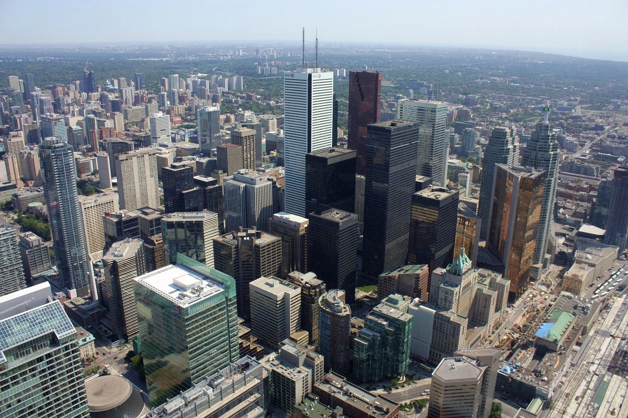 Downtown Toronto office towers in the financial district under a summer sky.