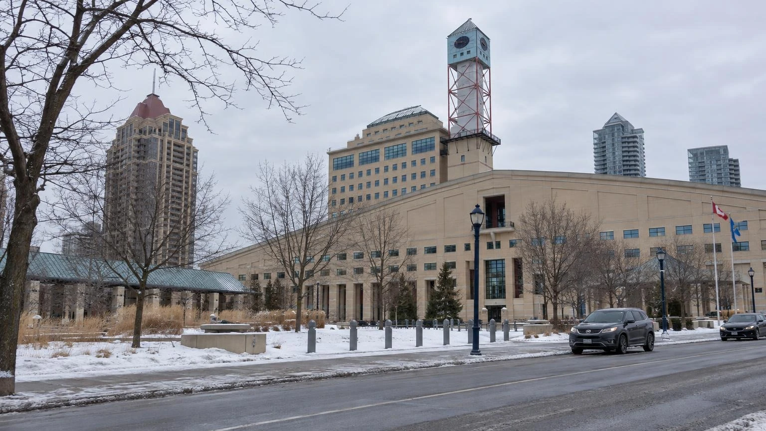 A view of a Mississauga residential street in winter with snow on the ground and bare trees.