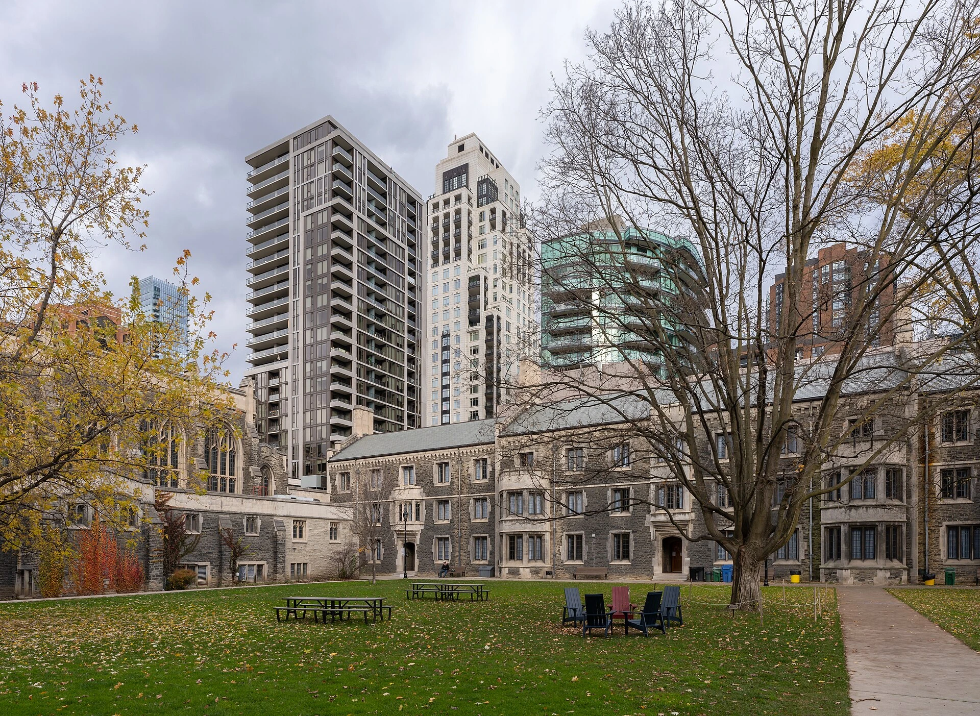 Illustration of a spring garden and walkway beside historic university buildings in Toronto.