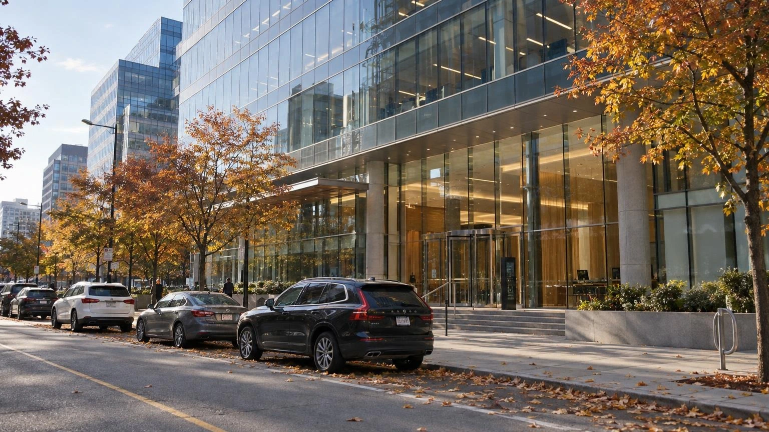 A modern office building exterior in a Toronto business district during autumn.