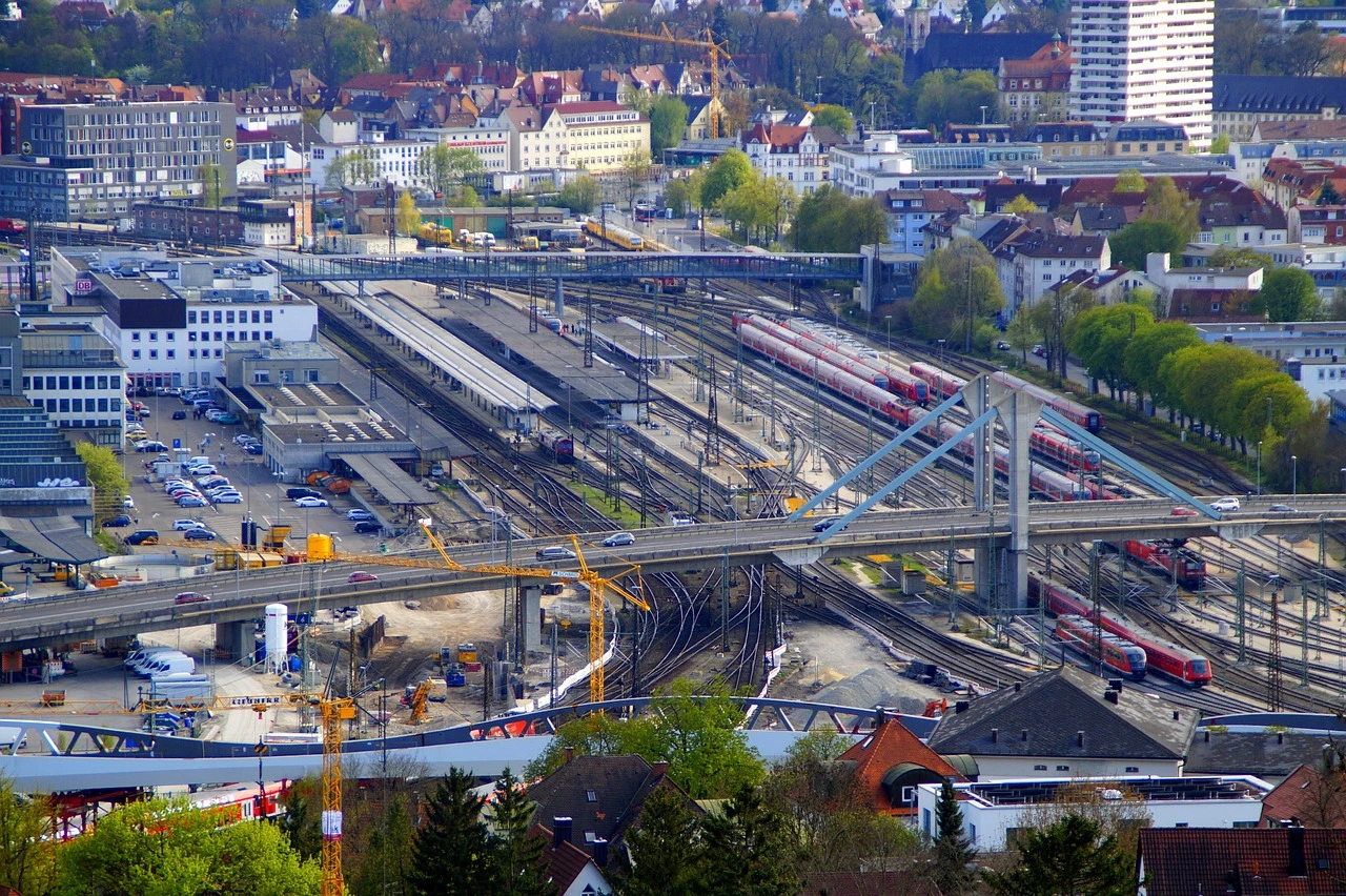 Illustration of a graded construction site beside rail lines for a new GO station in an Ontario town