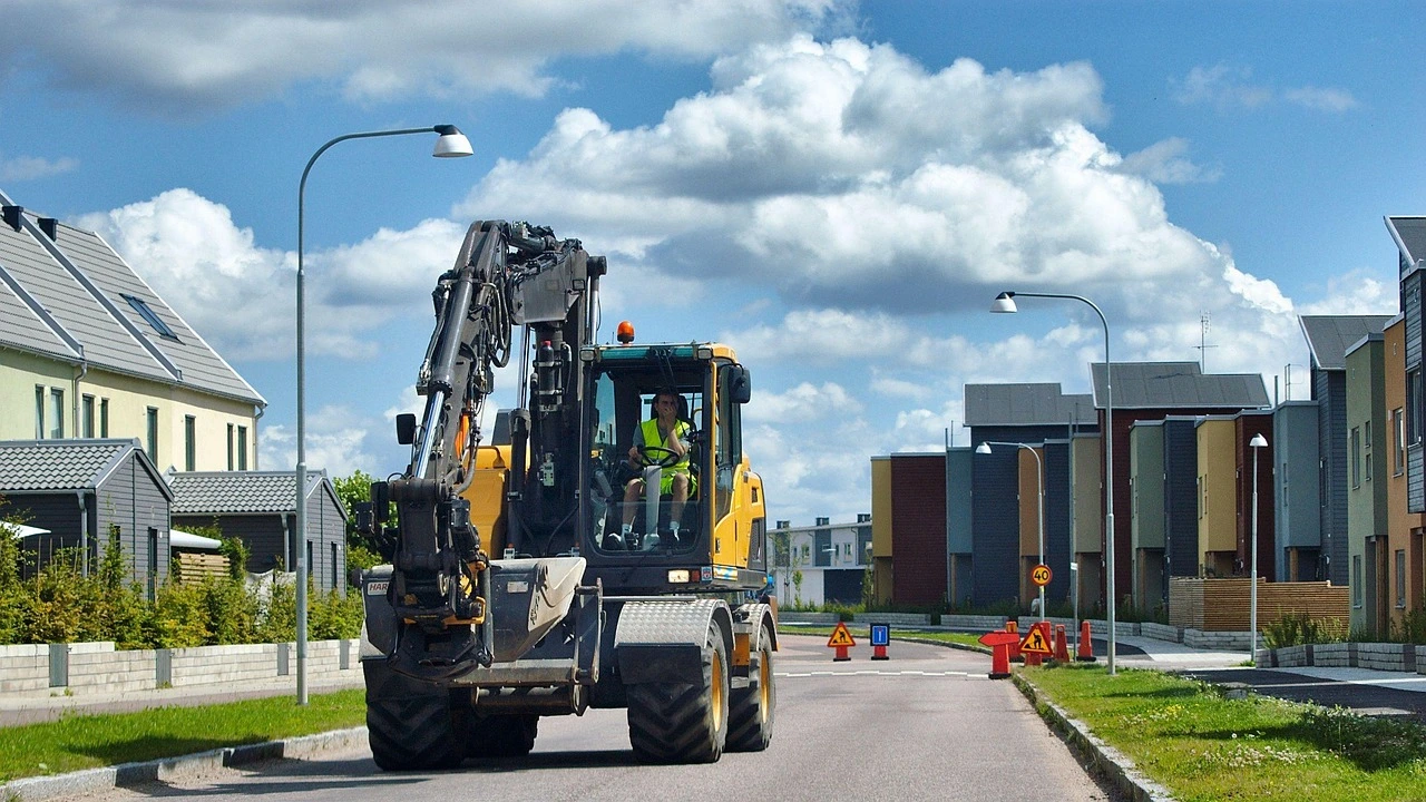 Excavation work with barricades on a quiet Ontario town street in autumn