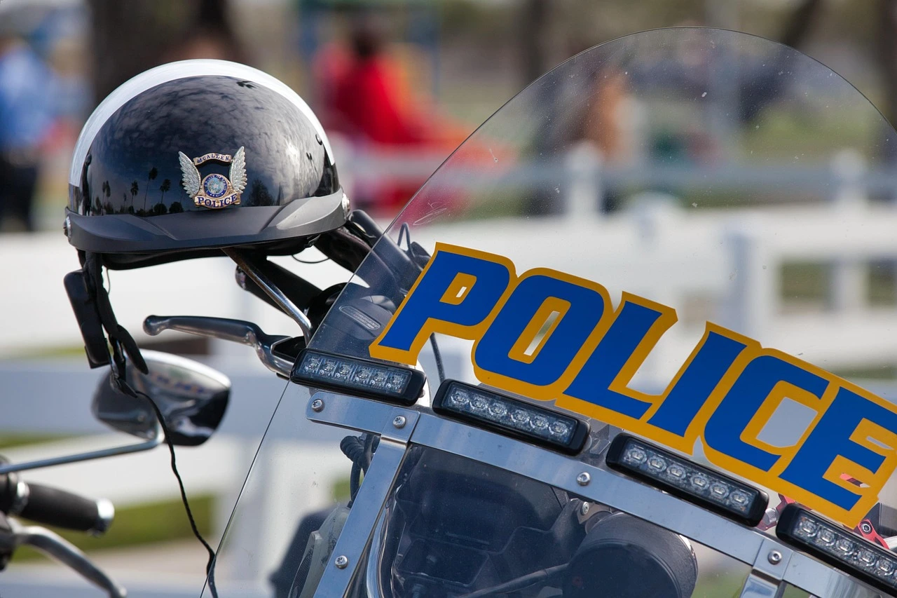 Police tape and a cruiser on a suburban arterial road, illustrating a crash investigation in Pickering.
