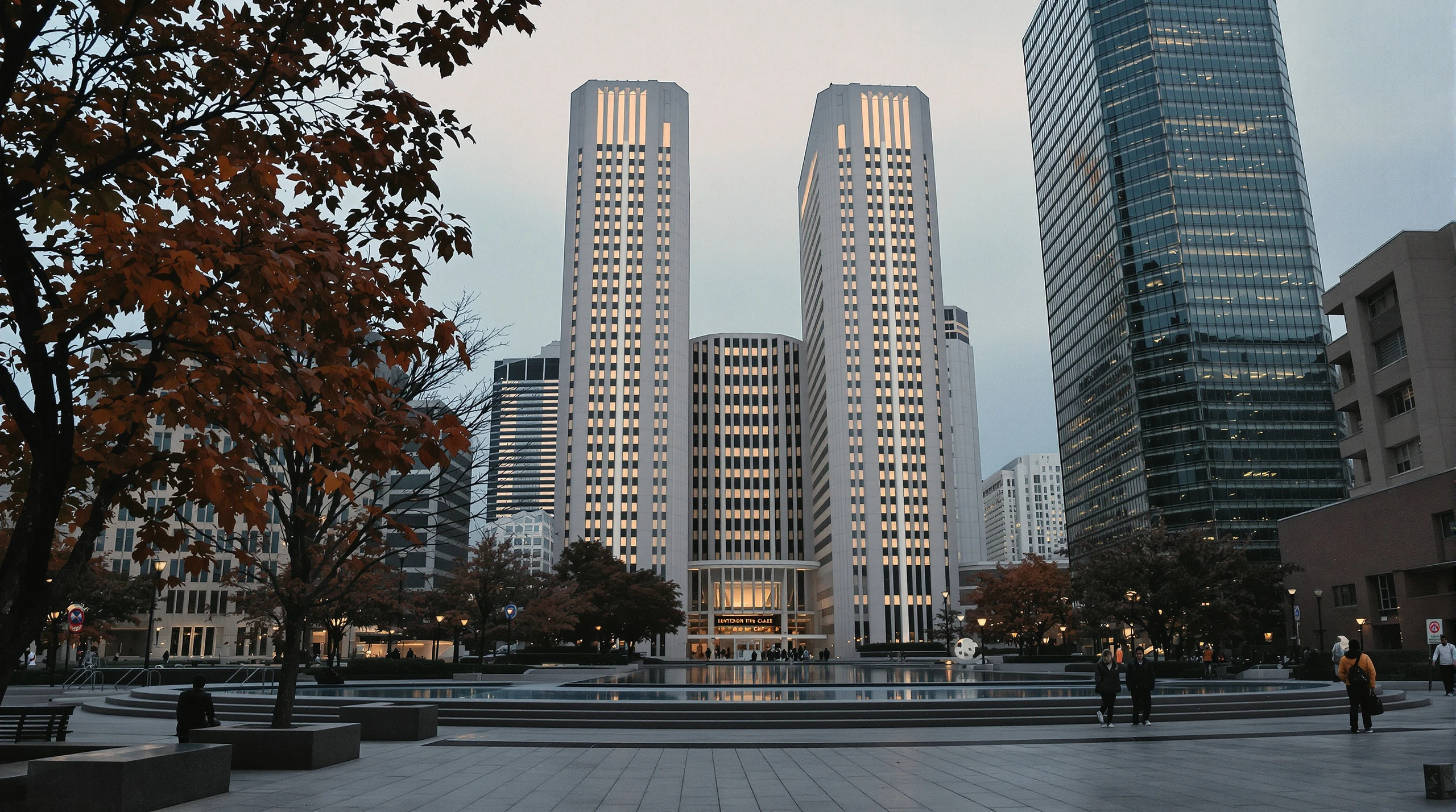 Toronto City Hall towers and Nathan Phillips Square at dusk in autumn, with pedestrians passing through the plaza.