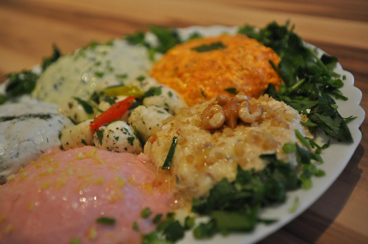 Shared plates on a table in a sunlit Middle Eastern restaurant dining room.