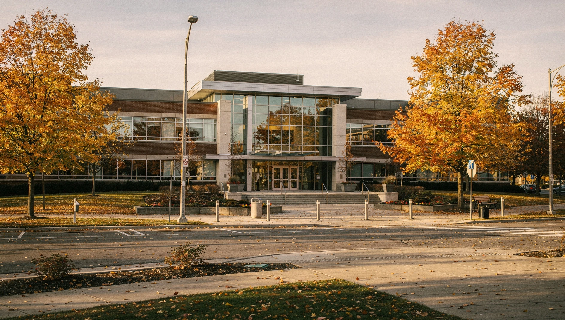 A wide shot of Markham City Hall exterior with autumn trees.