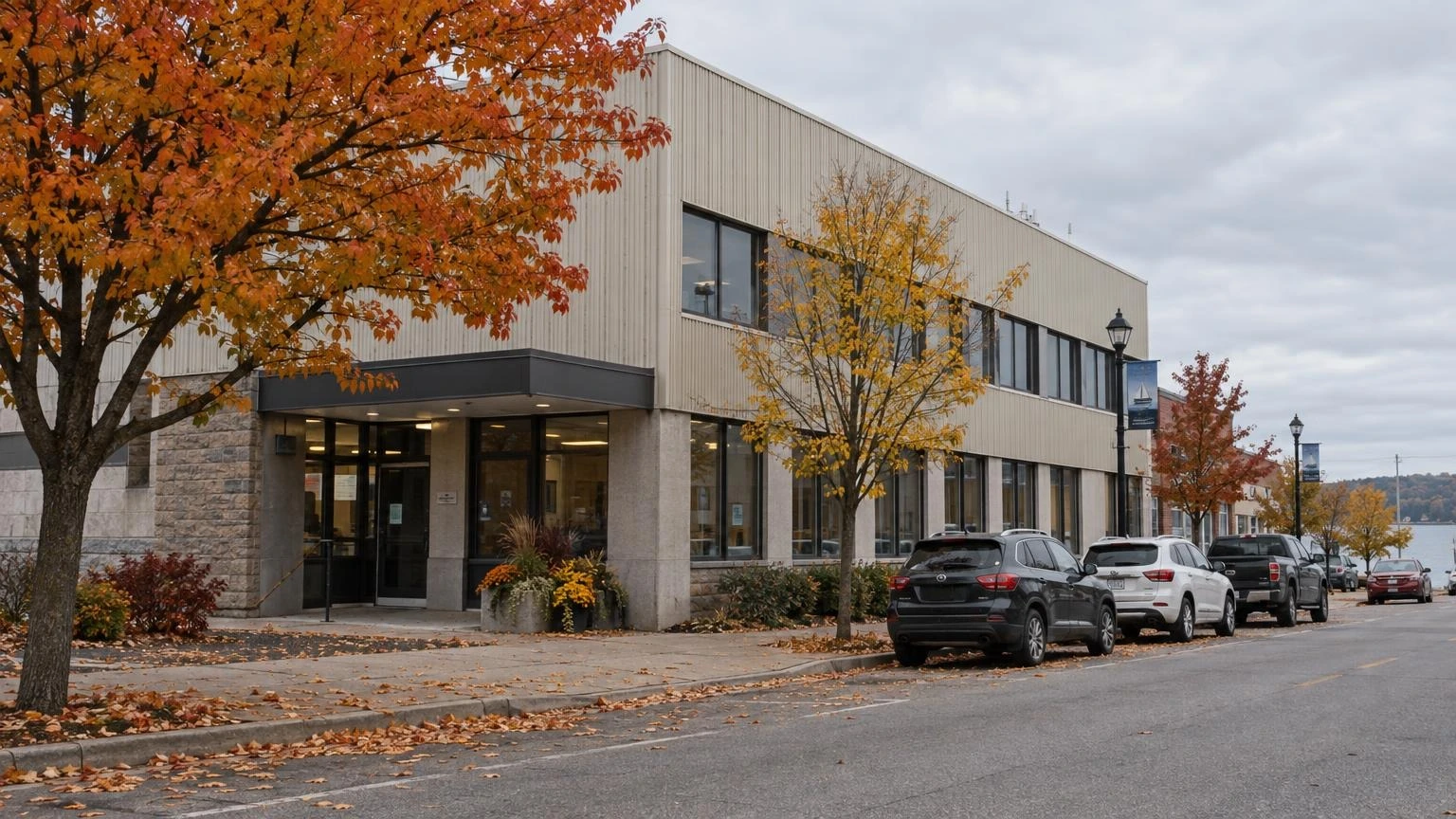 An exterior view of a commercial building on a street in Ontario during the autumn.