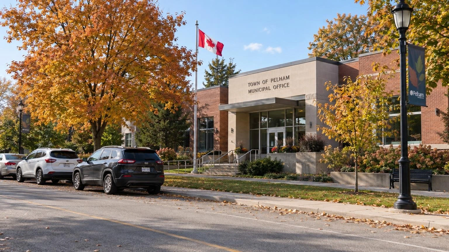 The exterior of a municipal building in Pelham, Ontario, surrounded by autumn trees.