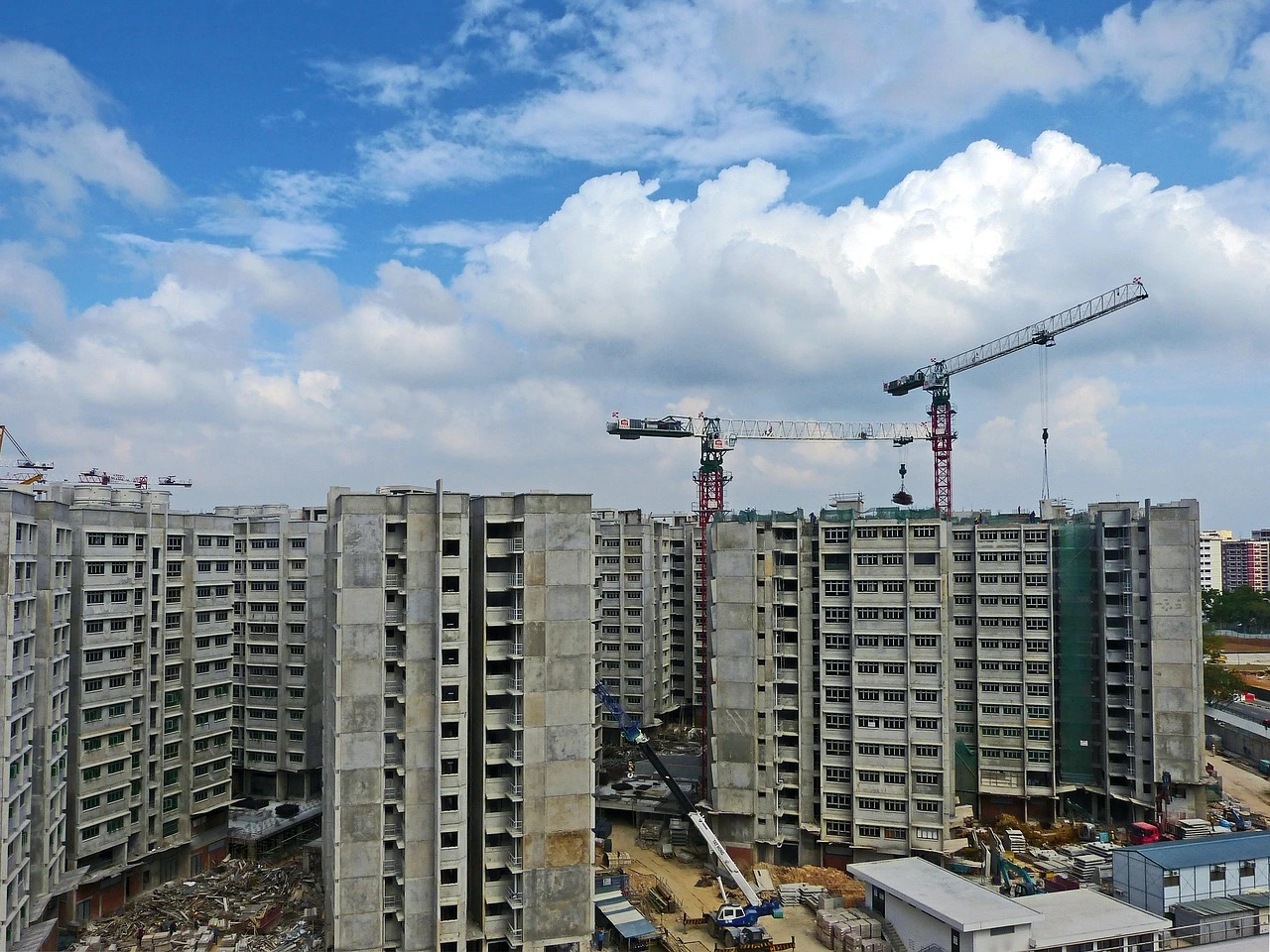 A view of a multi-storey residential construction site in a Toronto suburb during a clear summer day.