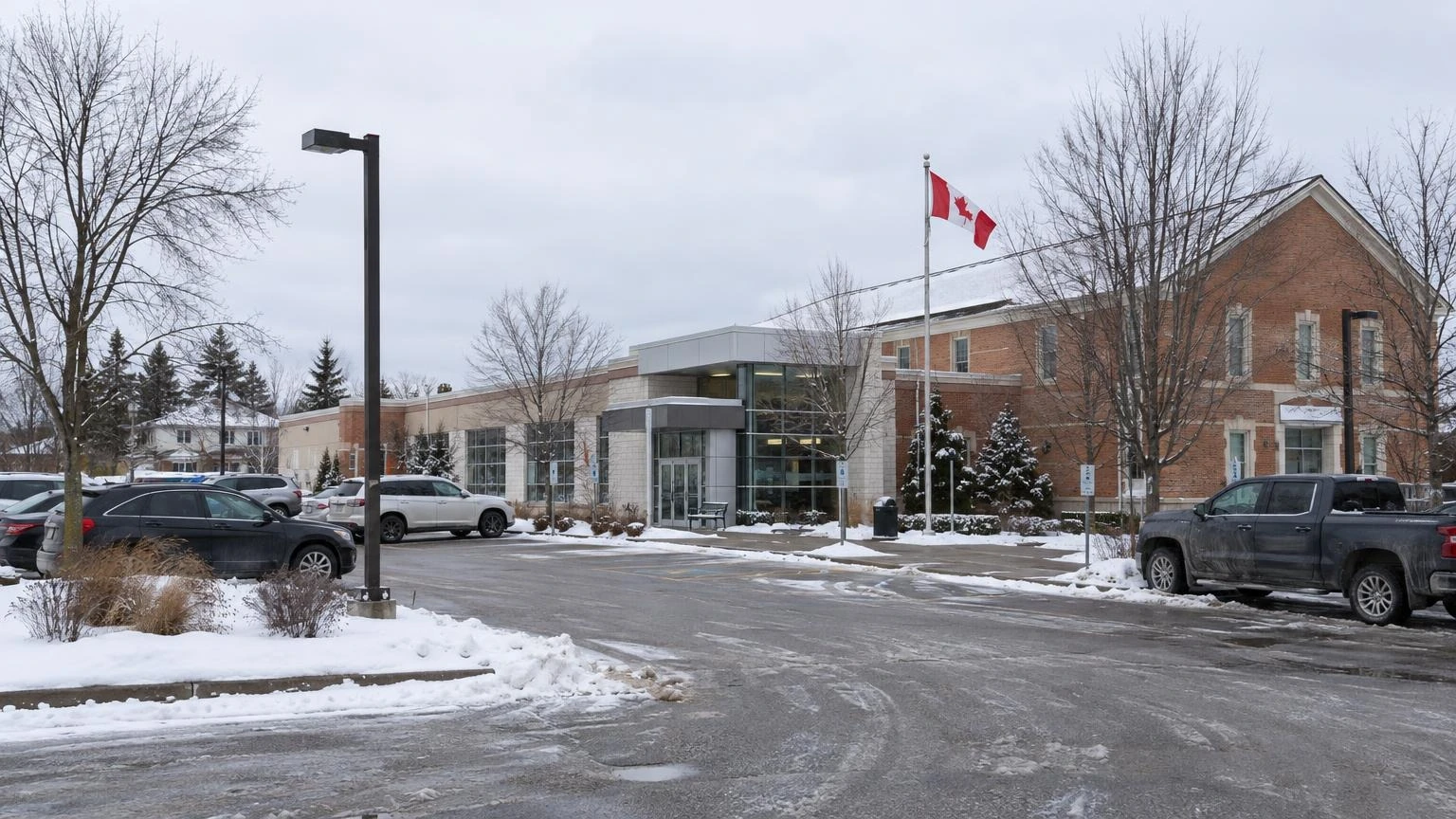An exterior view of a municipal building in Ontario during a winter afternoon.