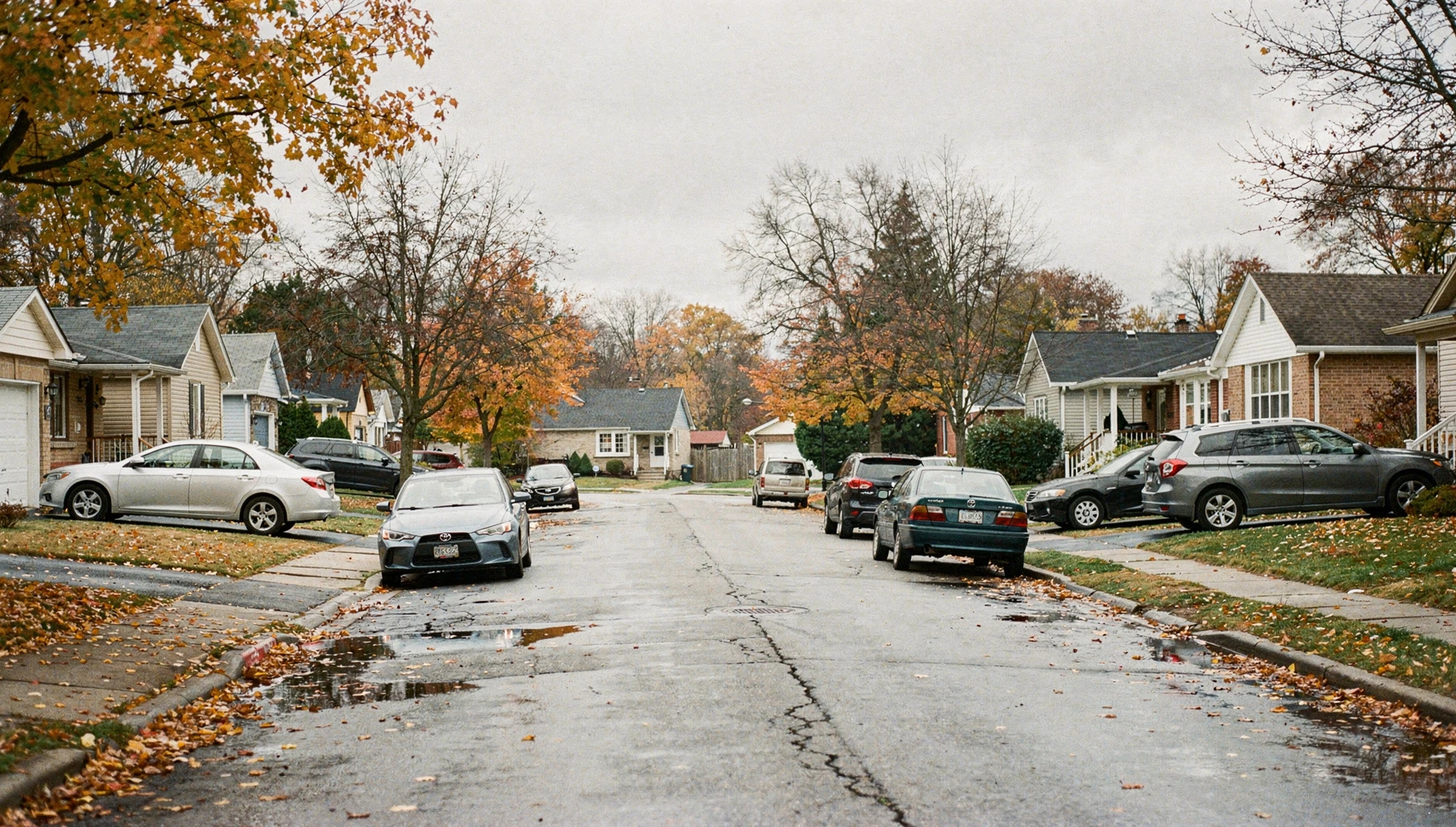 A residential street in Niagara Falls, Ontario, featuring suburban houses under an autumn sky.