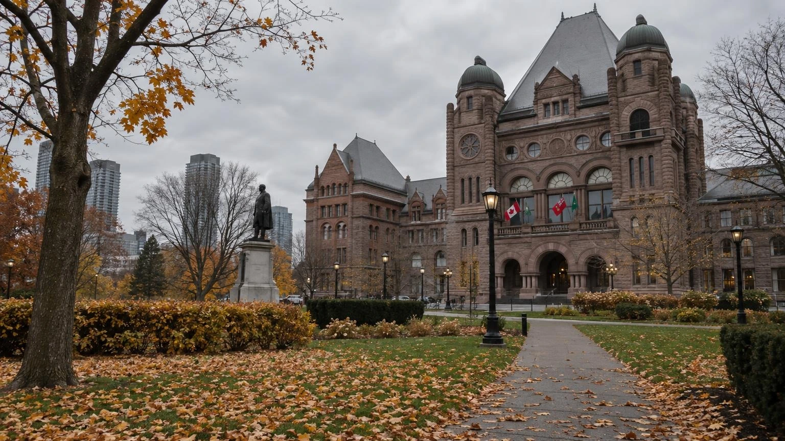 A wide shot of the Ontario Legislative Building at Queen's Park under a cloudy autumn sky.